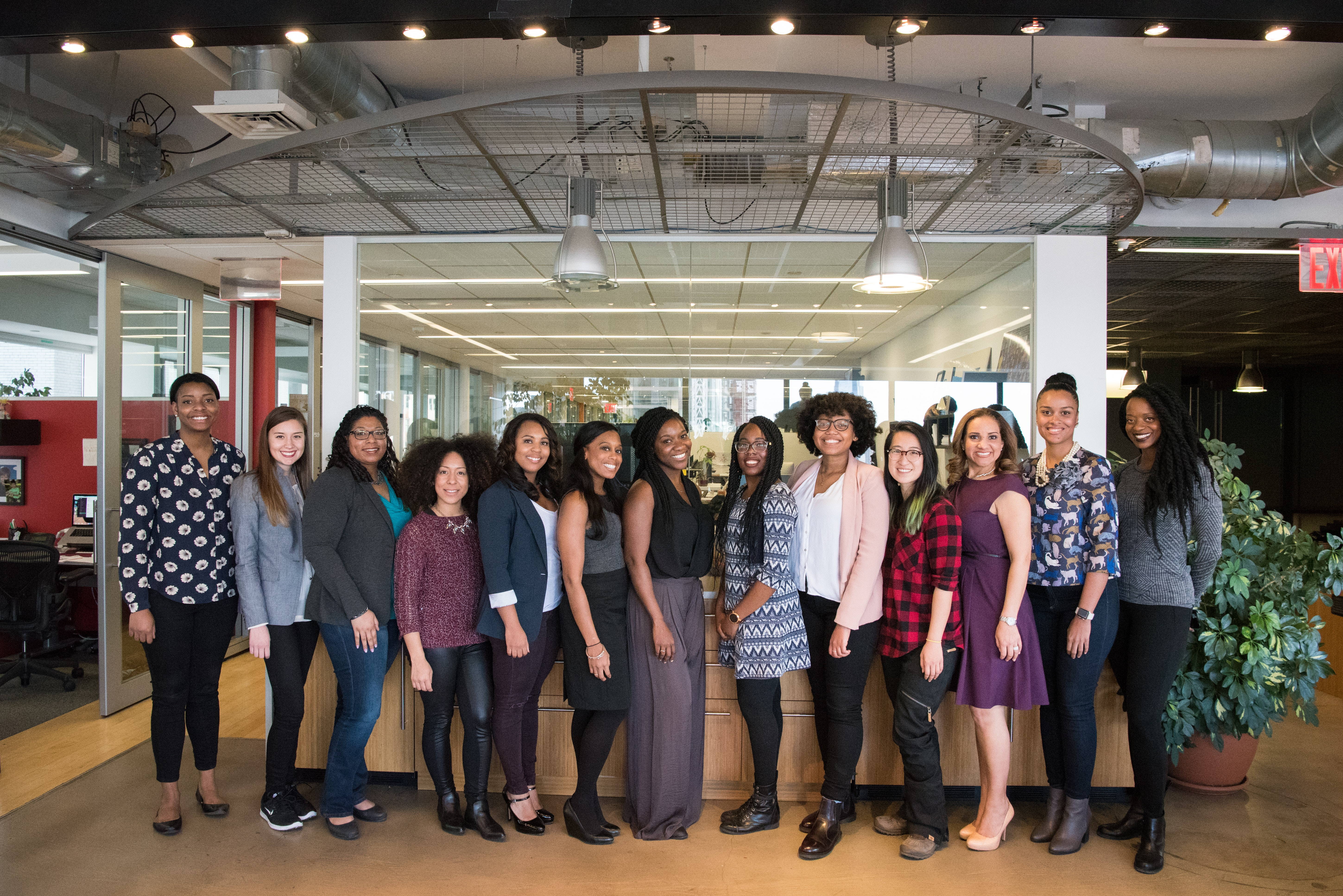 An image of our team standing in our office.